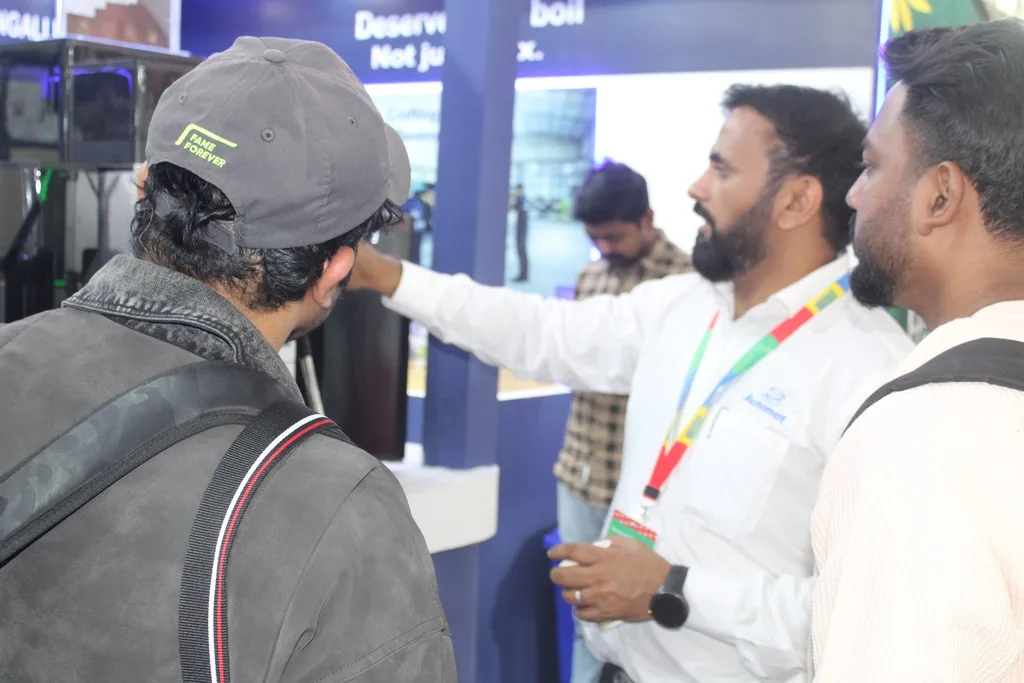 An Automat team member demonstrating a machine to visitors