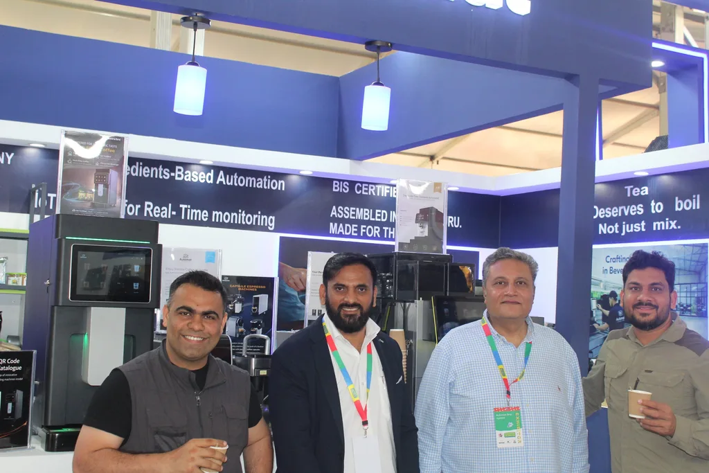 Automat team members with visitors at the Automat booth
