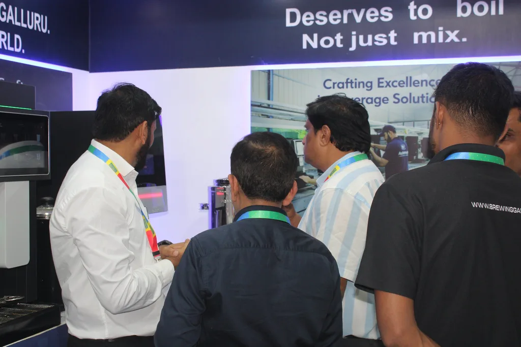 Visitors gathered around a machine demonstration at the Automat booth