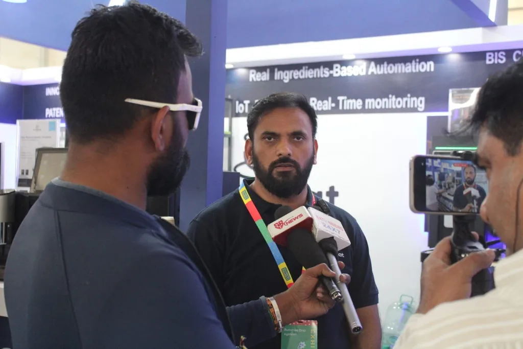 An Automat team member being interviewed at the booth