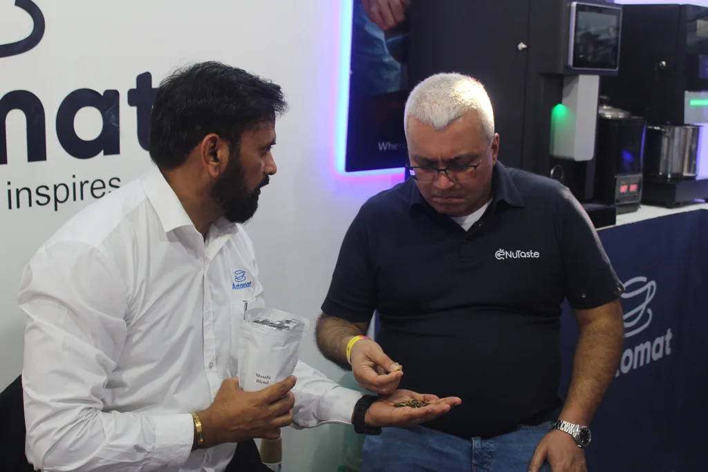 An Automat team member in conversation with a visitor