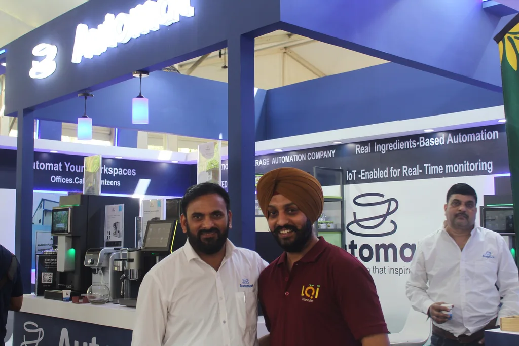 Visitors and Automat team members at the booth