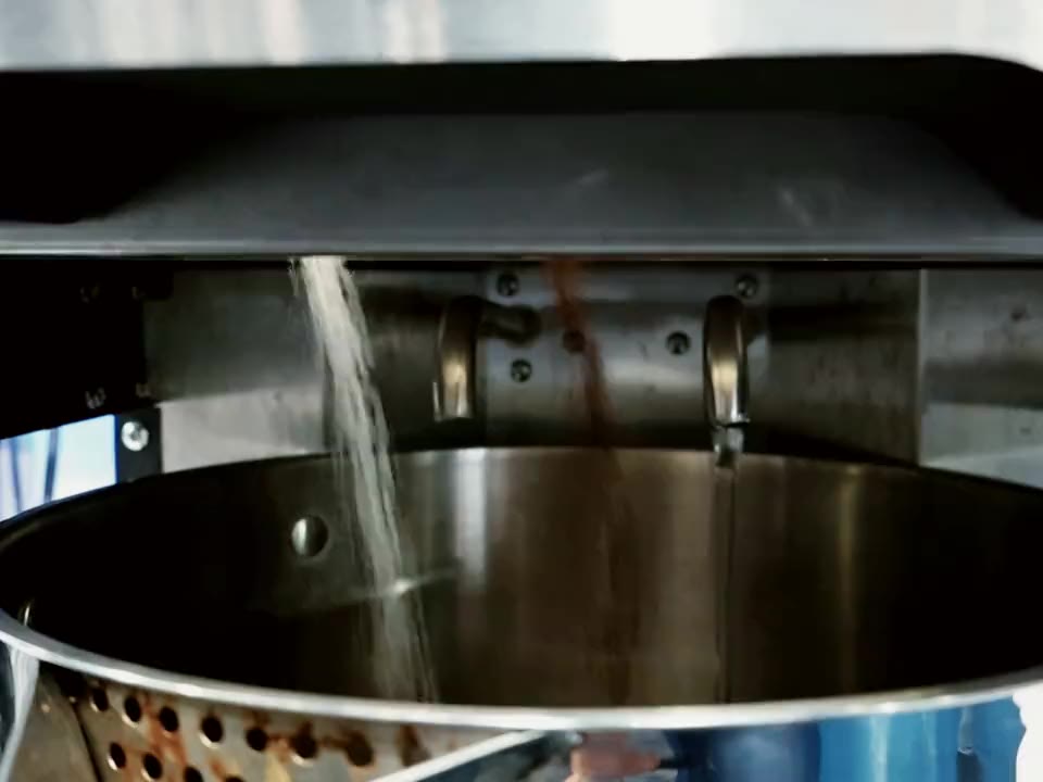 Tea and sugar dispensed into the BrewNex pot