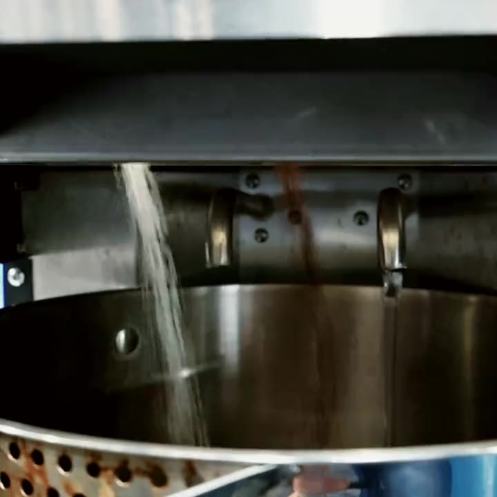 Tea leaves and sugar falling into the BrewNex pot