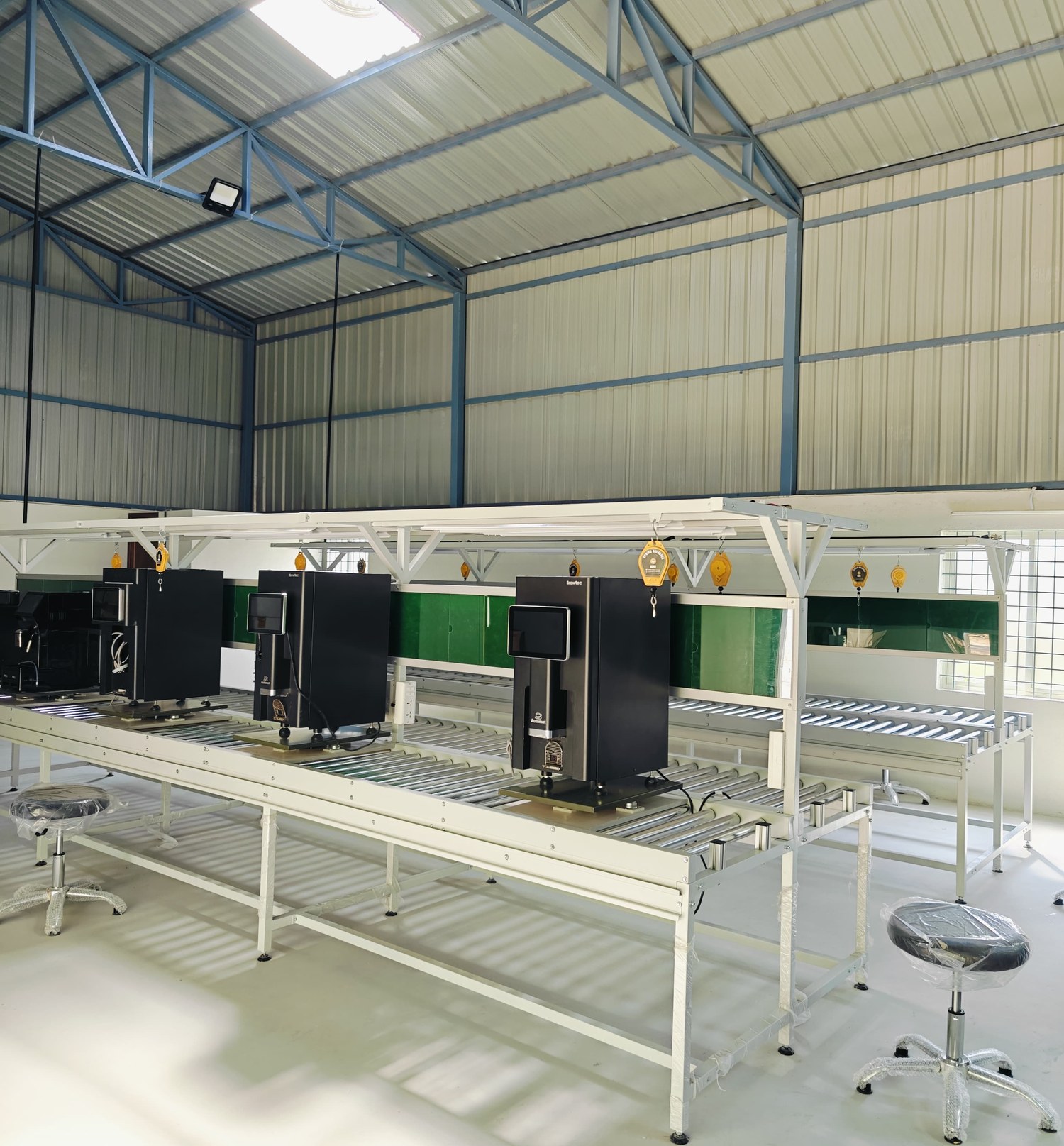 Machines on test benches on Automat's assembly floor